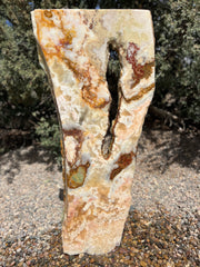 Grand Canyon Red Onyx stone fountain in a landscape setting handcrafted by The Rock Star Gallery®