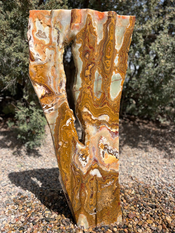 Grand Canyon Red Onyx stone fountain in a landscape setting handcrafted by The Rock Star Gallery®