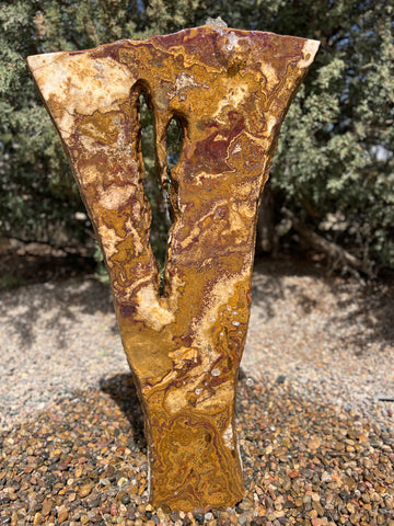 Grand Canyon Red Onyx stone fountain in a landscape setting handcrafted by The Rock Star Gallery®