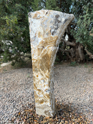 Black Canyon Onyx stone fountain in a landscape setting