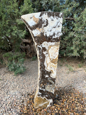 Black Canyon Onyx stone fountain in a landscape setting