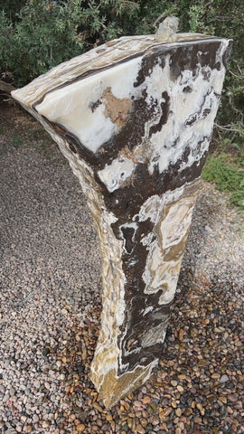 Black Canyon Onyx stone fountain in a landscape setting