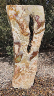 Grand Canyon Red Onyx stone fountain in a landscape setting handcrafted by The Rock Star Gallery®