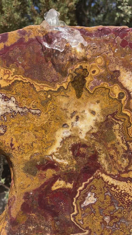 Grand Canyon Red Onyx stone fountain in a landscape setting handcrafted by The Rock Star Gallery®