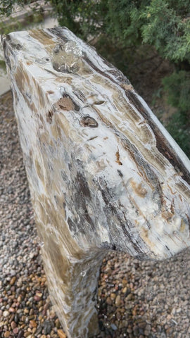 Black Canyon Onyx stone fountain in a landscape setting
