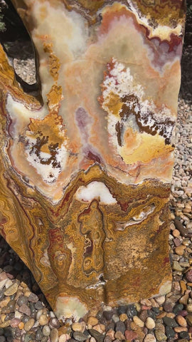 Grand Canyon Red Onyx stone fountain in a landscape setting handcrafted by The Rock Star Gallery®