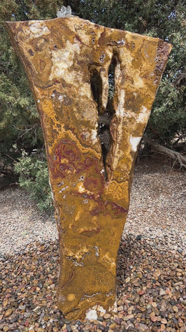 Grand Canyon Red Onyx stone fountain in a landscape setting handcrafted by The Rock Star Gallery®