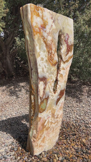 Grand Canyon Red Onyx stone fountain in a landscape setting handcrafted by The Rock Star Gallery®