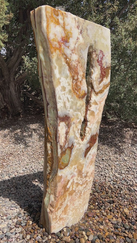 Grand Canyon Red Onyx stone fountain in a landscape setting handcrafted by The Rock Star Gallery®