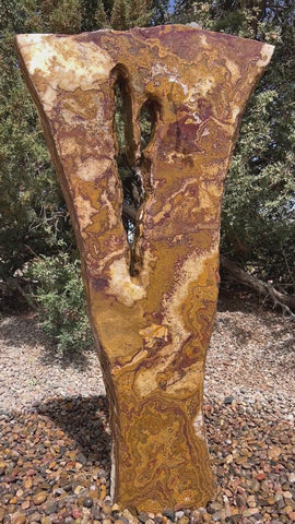 Grand Canyon Red Onyx stone fountain in a landscape setting handcrafted by The Rock Star Gallery®