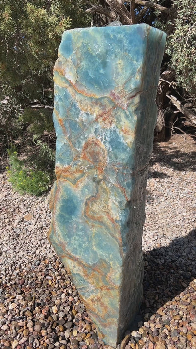 Argentine Aquamarine Onyx Stone Fountain in a landscape setting from The Rock Star Gallery