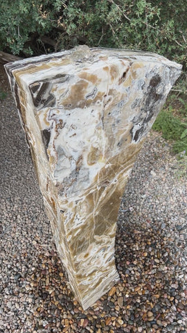 Black Canyon Onyx stone fountain in a landscape setting