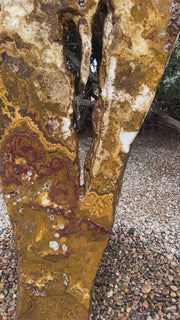 Grand Canyon Red Onyx stone fountain in a landscape setting handcrafted by The Rock Star Gallery®