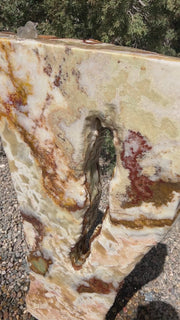 Grand Canyon Red Onyx stone fountain in a landscape setting handcrafted by The Rock Star Gallery®