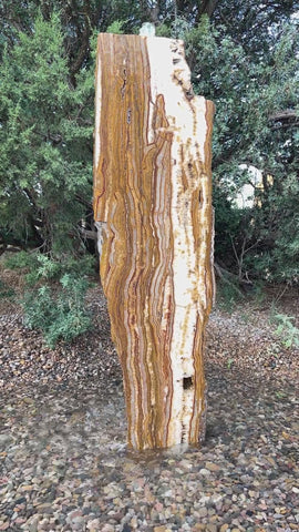 Grand Canyon Red Onyx Infinity Fountain in a landscape setting