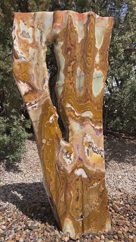 Grand Canyon Red Onyx stone fountain in a landscape setting handcrafted by The Rock Star Gallery®