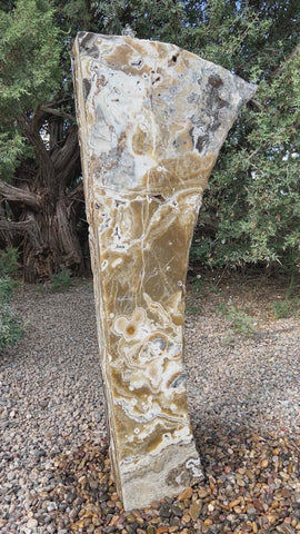 Black Canyon Onyx stone fountain in a landscape setting