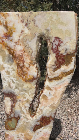 Grand Canyon Red Onyx stone fountain in a landscape setting handcrafted by The Rock Star Gallery®