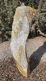 Caramel Canyon Onyx stone fountain made by The Rock Star Gallery in garden setting
