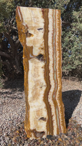 Grand Canyon Red Onyx stone fountain in a landscape setting handcrafted by The Rock Star Gallery®