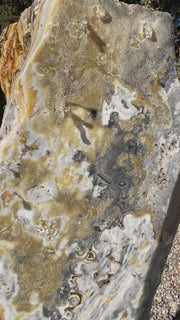 Caramel Canyon Onyx stone fountain made by The Rock Star Gallery in garden setting