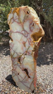 Sea of Cortez stone fountain with green coloring by The Rock Star Gallery in a landscape zen garden.