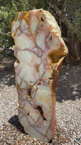 Sea of Cortez stone fountain with green coloring by The Rock Star Gallery in a landscape zen garden.