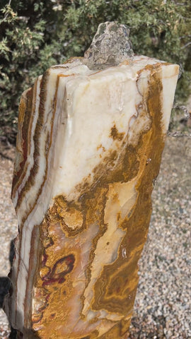Grand Canyon Red Onyx stone fountain in landscape setting by The Rock Star Gallery.
