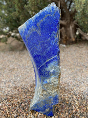 Blue Lapis Lazuli stone fountain by The Rock Star Gallery in outdoor landscape setting.