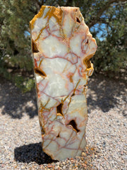 Sea of Cortez stone fountain with green coloring by The Rock Star Gallery in a landscape setting..