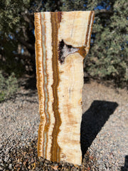 Grand Canyon Red Onyx stone fountain in a landscape setting handcrafted by The Rock Star Gallery®