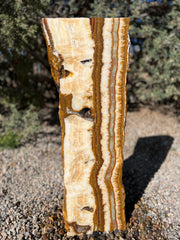 Grand Canyon Red Onyx stone fountain in a landscape setting handcrafted by The Rock Star Gallery®