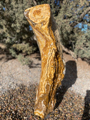 Caramel Canyon Onyx stone fountain made by The Rock Star Gallery in garden setting