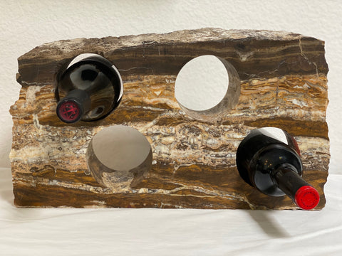 Stone wine bottle holder from The Rock Star Gallery is made from onyx and holds four bottles of wine.