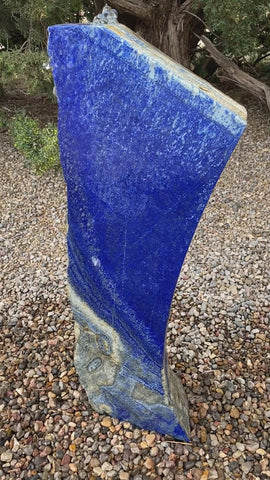 Blue Lapis Lazuli stone fountain by The Rock Star Gallery in outdoor landscape setting.