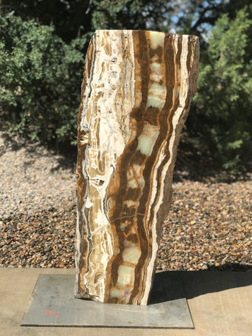 Verde Canyon Onyx stone fountain by The Rock Star Gallery in a landscape setting..